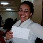 Jennifer Gonzalez (partner of Kenny Lazo) holding her check from the FU4J Xmas fundraiser.