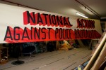 The finished National Action Against Police Brutality banner, by Raul Ayala. October 2014.