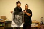 Artist Alma Sheppard-Matsuo posing with Cynthia Howell and the painting she did of Alberta Spruill. PCM Artists worked with FU4J to create art pieces so that family members could carry portraits of their loved ones during the National Day of Protest to Stop Police Brutality (October 22). October, 2014.